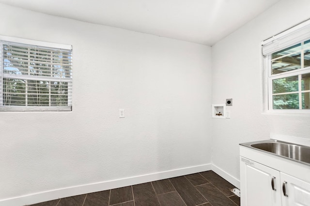 175 Weeks St, Lufkin, TX 75904 - washroom featuring cabinet space, electric dryer hookup, wood finish floors, and hookup for a washing machine