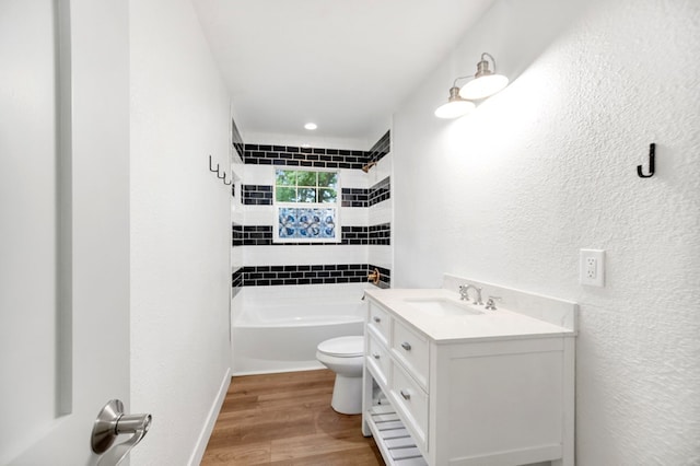 175 Weeks St, Lufkin, TX 75904 - bathroom with vanity, a textured wall, wood finished floors, and shower / tub combination