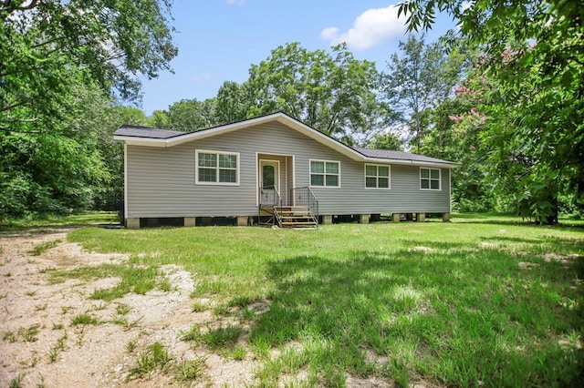 175 Weeks St, Lufkin, TX 75904 - back of house featuring a yard