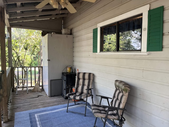 view of patio featuring ceiling fan and a deck