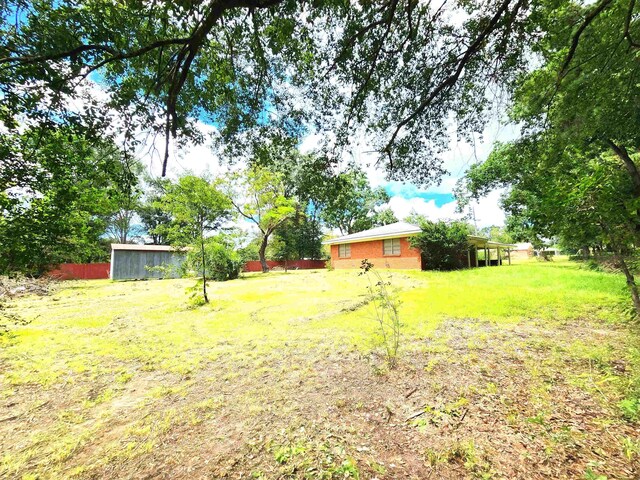 view of yard featuring a sunroom