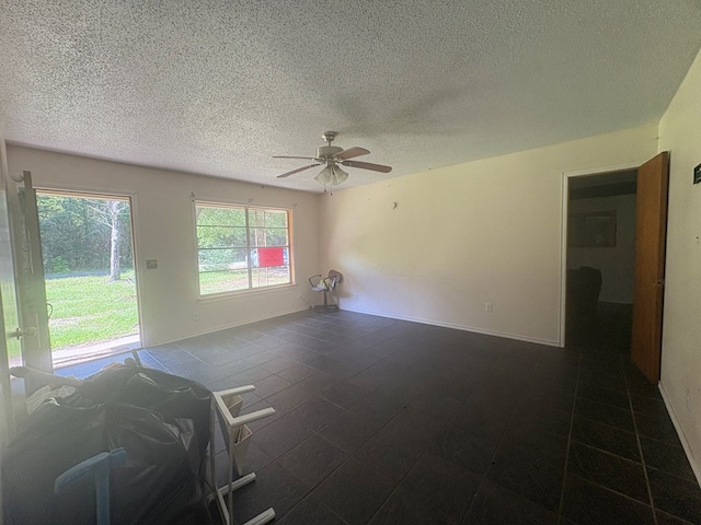 1169 County Road 619, Kirbyville, TX 75956 - unfurnished room featuring a textured ceiling and ceiling fan