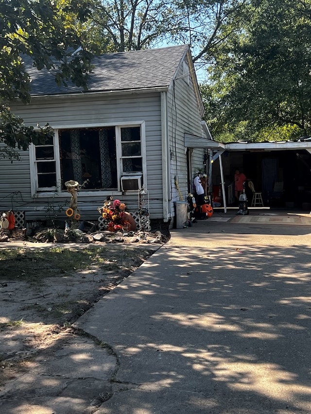 view of home's exterior featuring a carport