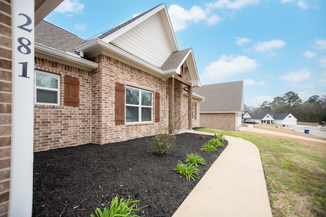 view of home's exterior featuring a lawn