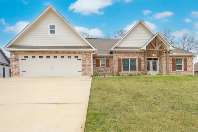 view of front of home featuring a garage and a front lawn