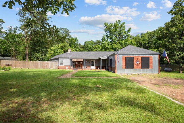 505 S Home St, Corrigan, TX 75939 - view of front of home featuring a chimney