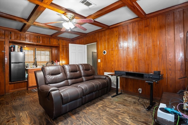505 S Home St, Corrigan, TX 75939 - living room with coffered ceiling, wood walls, ceiling fan, and beam ceiling