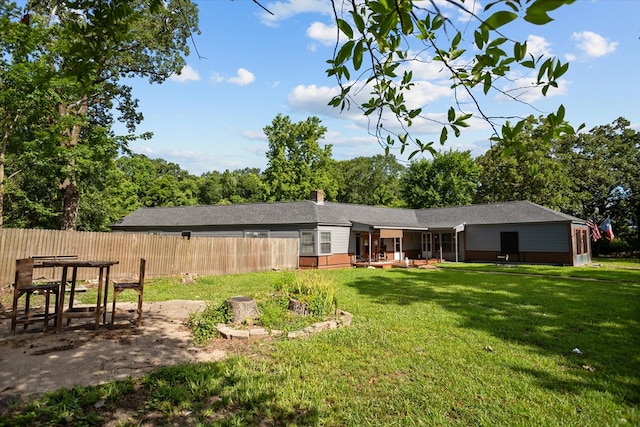 505 S Home St, Corrigan, TX 75939 - rear view of property with a patio and a chimney