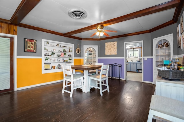 505 S Home St, Corrigan, TX 75939 - dining space with beam ceiling, ceiling fan, built in shelves, dark wood-type flooring, and crown molding