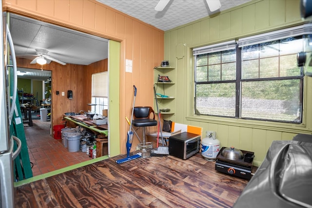 505 S Home St, Corrigan, TX 75939 - home office featuring ceiling fan and brick floors