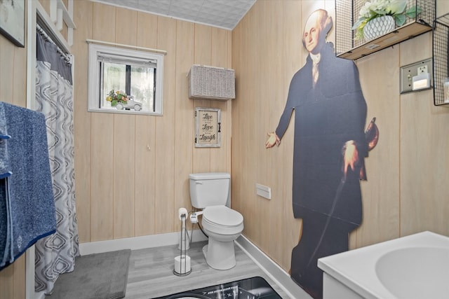 505 S Home St, Corrigan, TX 75939 - bathroom with toilet and wooden walls