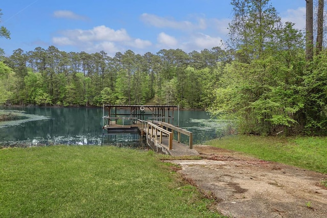211 Winfree Dr, Hemphill, TX 75948 - dock area featuring a wooded view, a water view, and a lawn