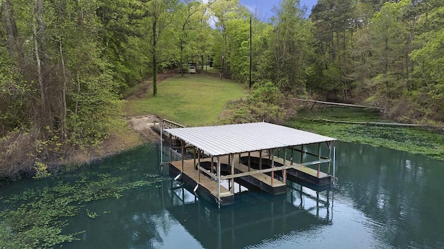 211 Winfree Dr, Hemphill, TX 75948 - view of dock with a water view, a view of trees, boat lift, and a yard