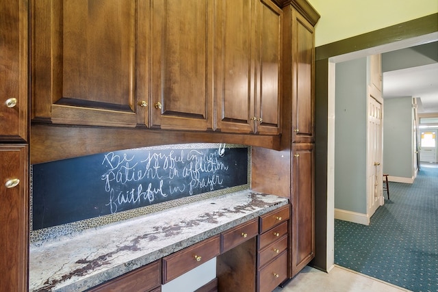 250 Main St, Jasper, TX 75951 - kitchen with light carpet and baseboards