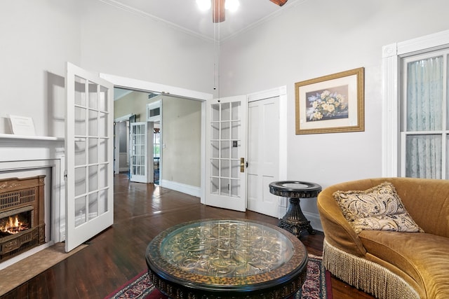 250 Main St, Jasper, TX 75951 - sitting room with french doors, baseboards, crown molding, a high ceiling, and wood finished floors