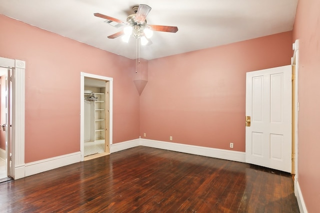 250 Main St, Jasper, TX 75951 - unfurnished bedroom featuring wood-type flooring, baseboards, and ceiling fan