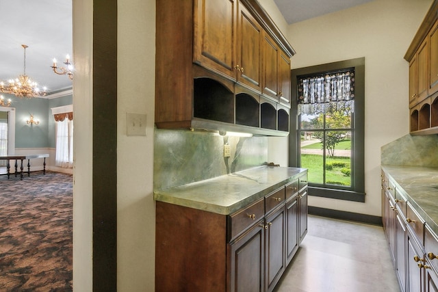 250 Main St, Jasper, TX 75951 - kitchen featuring open shelves, a chandelier, baseboards, and backsplash