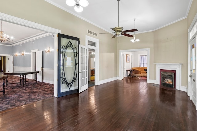 250 Main St, Jasper, TX 75951 - living room featuring a chandelier, a fireplace with flush hearth, wood finished floors, crown molding, and ceiling fan