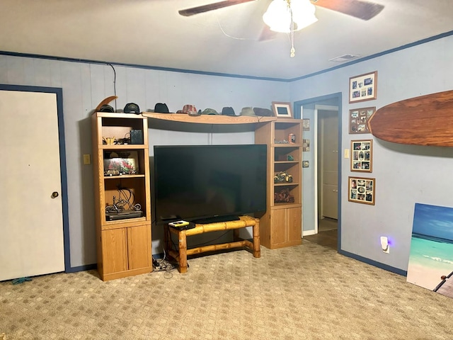 carpeted living room featuring ceiling fan