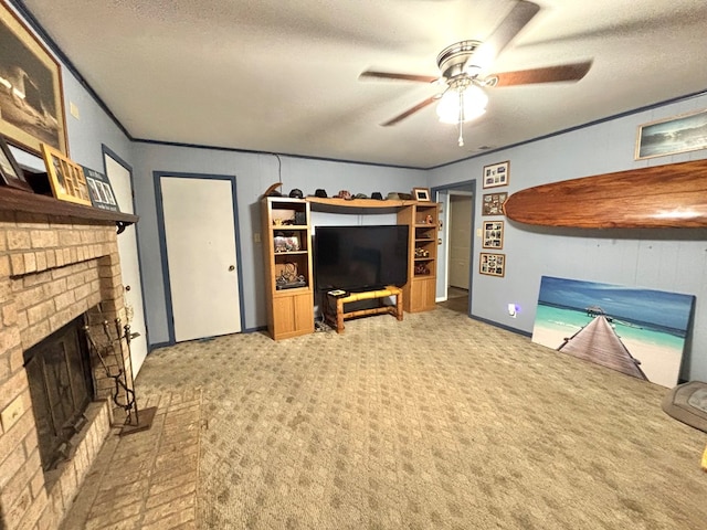 carpeted living room with a textured ceiling, ceiling fan, and a fireplace