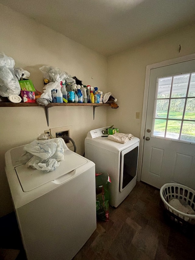 laundry area featuring washing machine and dryer and dark wood-type flooring