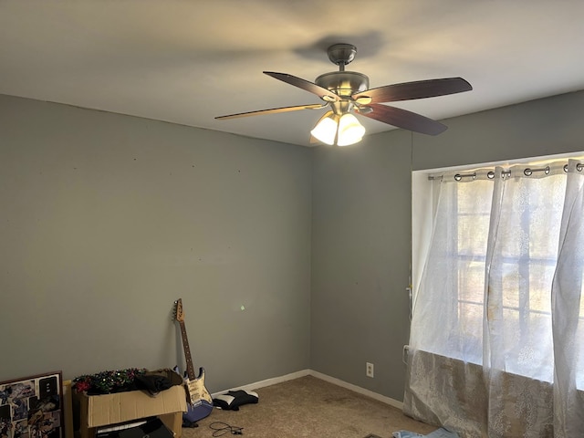 interior space featuring carpet floors and ceiling fan