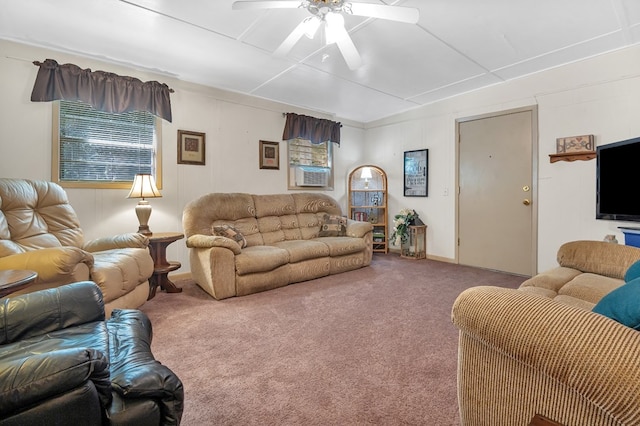 carpeted living room with ceiling fan and cooling unit