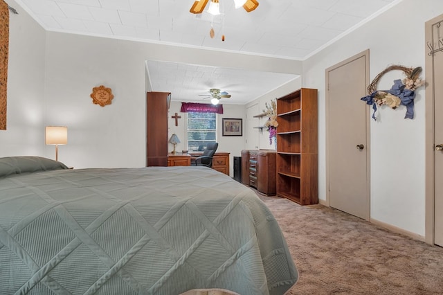 bedroom with light colored carpet, ceiling fan, and ornamental molding