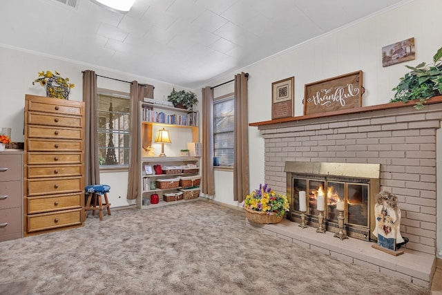 living area featuring carpet floors, a brick fireplace, and ornamental molding