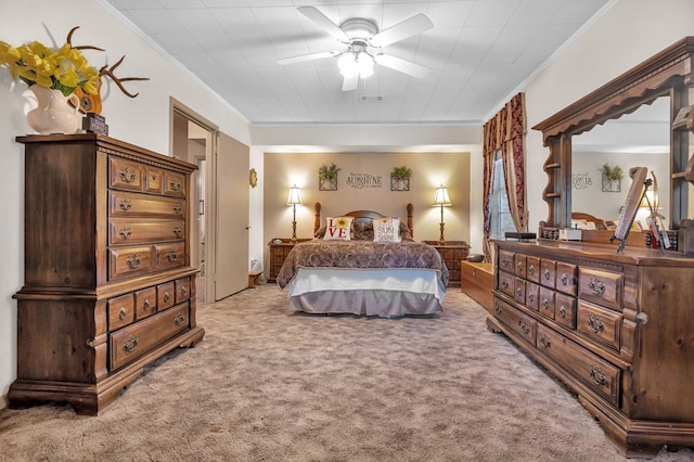 bedroom with ceiling fan, crown molding, and light carpet