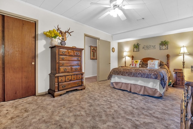 bedroom with carpet, ceiling fan, and crown molding