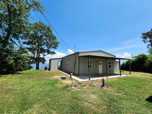 view of side of home featuring a yard