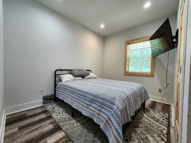 bedroom featuring baseboards, recessed lighting, and dark wood-type flooring