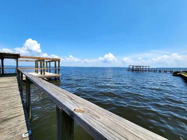 dock area featuring a water view