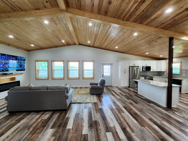 living area featuring wood ceiling, lofted ceiling with beams, dark wood-style flooring, recessed lighting, and a fireplace