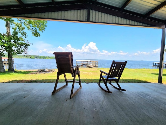 view of patio with a water view