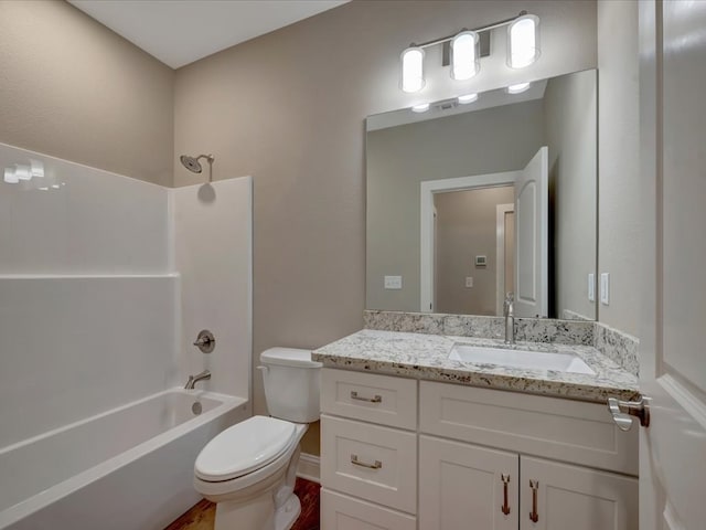 full bathroom featuring toilet, baseboards,  shower combination, and vanity
