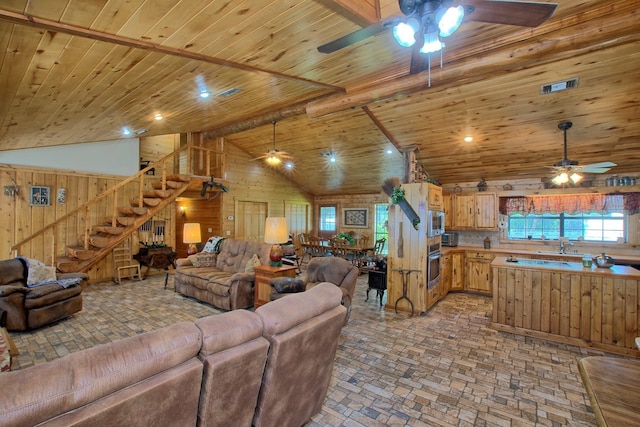 386 Paradise Dr, Hemphill, TX 75948 - living room featuring high vaulted ceiling, wooden ceiling, and wood walls