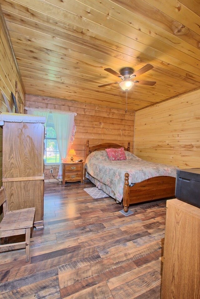 386 Paradise Dr, Hemphill, TX 75948 - bedroom with wood ceiling, ceiling fan, wooden walls, and dark wood-type flooring