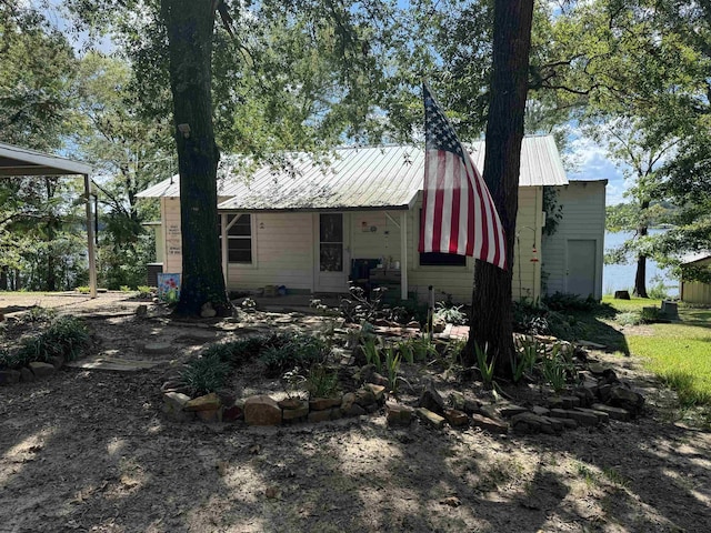 back of house featuring a garage