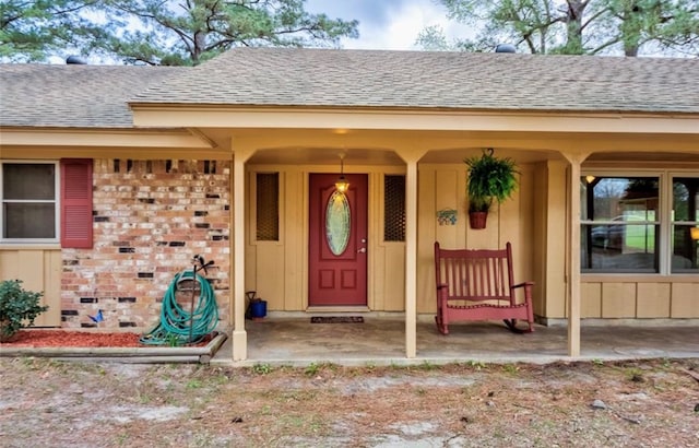 property entrance with covered porch