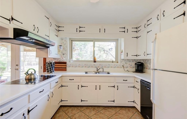 kitchen featuring backsplash, white cabinetry, sink, and black appliances