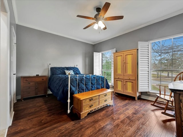 bedroom with ceiling fan, dark hardwood / wood-style floors, crown molding, and multiple windows