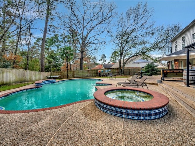 view of pool with a fenced backyard, an in ground hot tub, a patio, and a fenced in pool