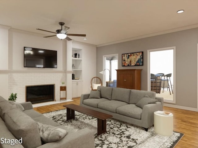 12 Columbia Ct, Lufkin, TX 75901 - living area with a ceiling fan, wood finished floors, crown molding, a fireplace, and recessed lighting