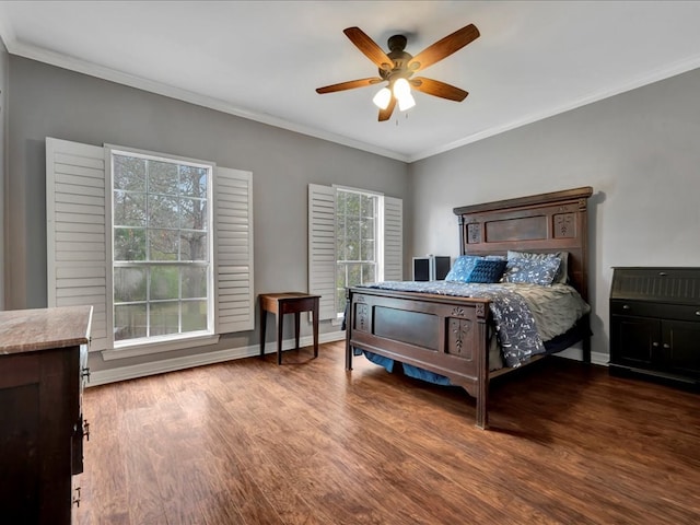 bedroom featuring ceiling fan, crown molding, and hardwood / wood-style flooring