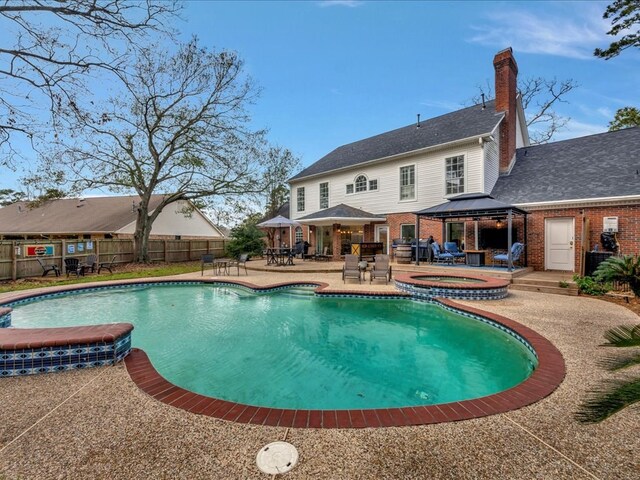 12 Columbia Ct, Lufkin, TX 75901 - view of swimming pool with a gazebo, a patio area, a pool with connected hot tub, and outdoor dining area