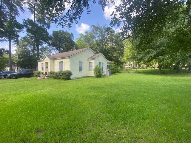 609 Marion Dr, Lufkin, TX 75901 - view of property exterior featuring a cooling unit and a lawn