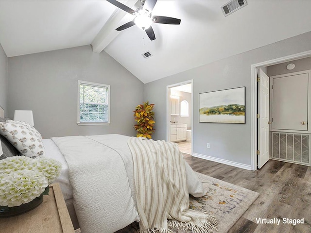 bedroom with visible vents, baseboards, wood finished floors, and vaulted ceiling with beams