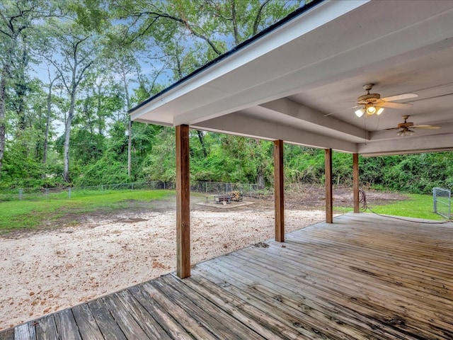 wooden deck featuring ceiling fan